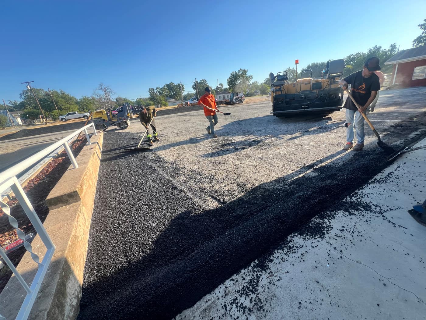 Asphalt repair crew fixing a parking lot